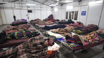 People seen inside a homeless shelter at Kashmere Gate, on Tuesday. (Sanchit Khanna/HT)