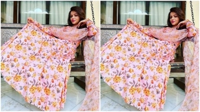 Rubina paired a white long kurti with full sleeves with a silk dupatta with the same print. Rubina's salwar came with full sleeves and pleated details below the waist. (Instagram/@rubinadilaik)