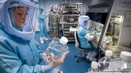BioNTech employees in cleanroom suits test the procedures for the manufacturing of the vaccine(Thomas Lohnes/AFP/Getty Images)