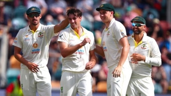 Australia's Pat Cummins, second left, celebrates with teammates after taking the wicket of England's Zak Crawley during their Ashes cricket Test match in Hobart, Australia.(AP) Australia's Pat Cummins, second left, celebrates with teammates after taking the wicket of England's Zak Crawley during their Ashes cricket Test match in Hobart, Australia.(AP)