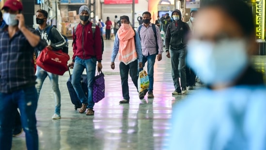 Outstation passengers wait in a queue to undergo the Covid-19 test at Chhatrapati Shivaji Maharaj Terminus.&nbsp;(PTI)