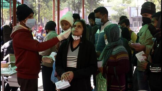 A health worker collects swab samples for Covid-19 test at the Combined District Hospital in Sanjay Nagar, Ghaziabad, on Wednesday. (Sakib Ali /HT)