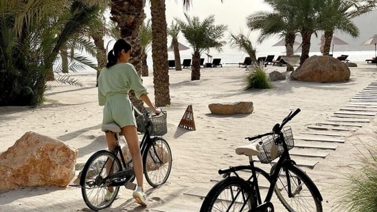 Manushi spent the day in Oman going on a bicycle ride and playing badminton with her travel buddies. She posted photos of herself getting on a bicycle before going on a ride around the resort and playing badminton in a court. Both pictures had a glorious view of the hills, the sea and the palm trees.(Instagram/@manushi_chhillar)