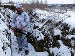 A serviceman stands holding his machine-gun in a trench on the territory controlled by pro-Russian militants at the frontline with Ukrainian government forces in Slavyanoserbsk, Luhansk region, eastern Ukraine. A serviceman stands holding his machine-gun in a trench on the territory controlled by pro-Russian militants at the frontline with Ukrainian government forces in Slavyanoserbsk, Luhansk region, eastern Ukraine.