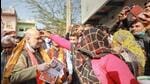 Union home minister Amit Shah during door-to-door election campaign at Satoha village in Mathura district on Thursday. (PTI PHOTO)