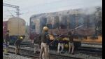 Railway Protection Force (RPF) personnel in action after two boogies of an empty train were set on fire by the railway job aspirants in Gaya on Wednesday. (Santosh Kumar/HT Photo) Railway Protection Force (RPF) personnel in action after two boogies of an empty train were set on fire by the railway job aspirants in Gaya on Wednesday. (Santosh Kumar/HT Photo)