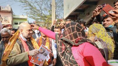 Union home minister Amit Shah during door-to-door election campaign at Satoha village in Mathura district on Thursday. (PTI PHOTO) Union home minister Amit Shah during door-to-door election campaign at Satoha village in Mathura district on Thursday. (PTI PHOTO)