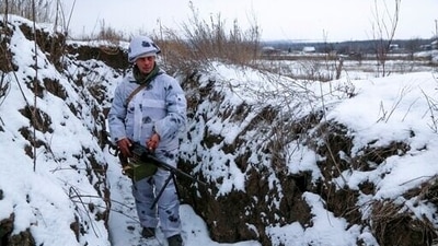 A serviceman stands holding his machine-gun in a trench on the territory controlled by pro-Russian militants at the frontline with Ukrainian government forces in Slavyanoserbsk, Luhansk region, eastern Ukraine. (AP) A serviceman stands holding his machine-gun in a trench on the territory controlled by pro-Russian militants at the frontline with Ukrainian government forces in Slavyanoserbsk, Luhansk region, eastern Ukraine. (AP)
