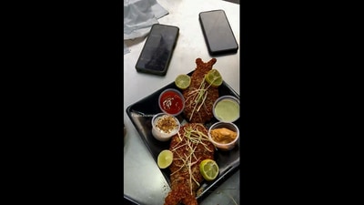 The image, taken from the Instagram video, shows a man at an eatery in Delhi preparing the ‘veg fish’ made with soya beans. (Instagram/@foodie_incarnate)