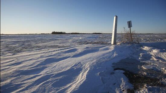 A border marker between the United States and Canada is shown just outside of Emerson, Manitoba. Bodies of four people, including a baby and a teen, were found in Canada near the US border, in what authorities believe was a failed crossing attempt during a freezing blizzard. (AP)