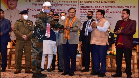An insurgent handing over arms to Assam Chief Minister Himanta Biswa Sarma at Guwahati on Thursday. (TWITTER/@Himanta Biswa Sarma.) An insurgent handing over arms to Assam Chief Minister Himanta Biswa Sarma at Guwahati on Thursday. (TWITTER/@Himanta Biswa Sarma.)