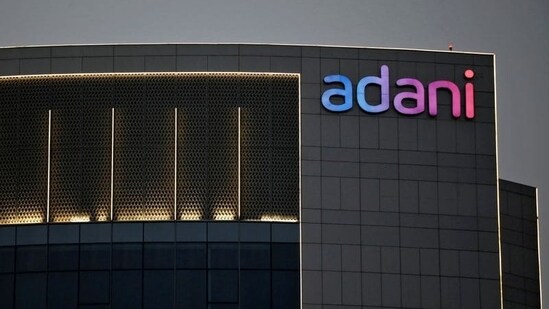 The logo of the Adani Group is seen on the facade of one of its buildings on the outskirts of Ahmedabad.(REUTERS)