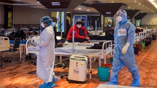 Covid-19 patients undergo treatment inside the Shehnai Banquet Hall, a Covid-19 care facility, in New Delhi.(PTI Photo)