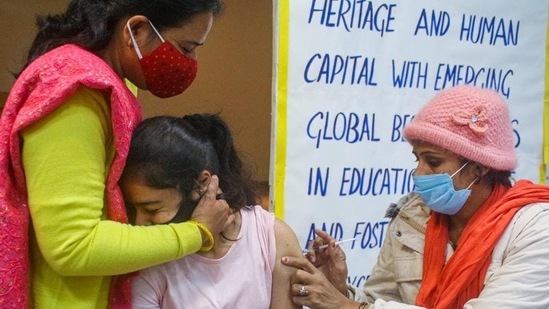 A health worker administers a Covid-19 vaccine to a teenager in Gurugram. (PTI File) A health worker administers a Covid-19 vaccine to a teenager in Gurugram. (PTI File)