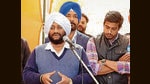 AAP candidate Kulwant Singh addressing residents while campaigning in Mohali. (HT Photo)
