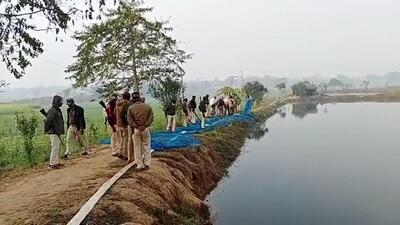 Police at a site where at least six people died after allegedly consuming spurious liquor in Buxar. (ANI) Police at a site where at least six people died after allegedly consuming spurious liquor in Buxar. (ANI)