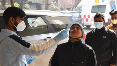 A health worker collects swab samples of a man for Covid-19 testing, in Gurugram on Thursday. (Vipin Kumar /HT) A health worker collects swab samples of a man for Covid-19 testing, in Gurugram on Thursday. (Vipin Kumar /HT)