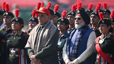 In this picture, PM Modi can be seen posing for a photograph with India's Defence Minister Rajnath Singh and the National Cadet Corps (NCC) cadets. (AFP) In this picture, PM Modi can be seen posing for a photograph with India's Defence Minister Rajnath Singh and the National Cadet Corps (NCC) cadets. (AFP)