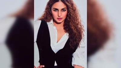 Huma Qureshi is like a breath of fresh air in wide-cut pants, white unbuttoned shirt and black waistcoat. (Instagram/@iamhumaq)