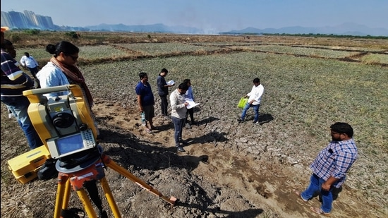 The survey of the car shed land for Wadala to Thane Metro Line 4 project began at Mogharpada area of Ghodbunder in Thane on Friday. (PRAFUL GANGURDE/HT PHOTO)