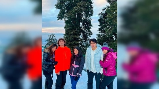 In the photos captured amidst the snowcapped mountains, Sara Ali Khan can be seen beating the cold in a violet puffer jacket which she teamed with black joggers, boots and a grey woollen cap.(Instagram/@saraalikhan95)