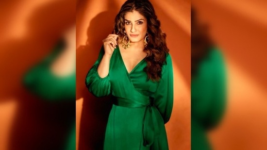 Raveena Tandon styled her look with a pair of white stilettoes, tinted hoop earrings and a bracelet.(Instagram/@raveenatandon)