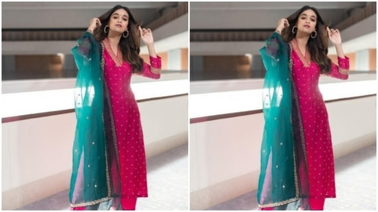 Keerthy paired a full-sleeved pink salwar with golden zari details, with a pair of silk pink trousers with wide legs. Keerthy's salwar came intricately embroidered in golden resham threads. She completed her look with a contrasting silk green dupatta with golden zari details at the borders.(Instagram/@keerthysureshofficial)