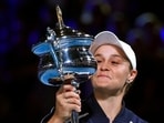 Ash Barty of Australia holds the Daphne Akhurst Memorial Cup aloft after defeating Danielle Collins of the U.S., in the women's singles final at the Australian Open tennis championships.(AP)