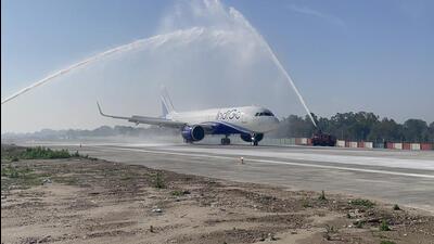 Indigo flight 6E-137 receives a water cannon salute by Indian Air Force for being the first flight to traverse through the newly constructed portion of the extended runway in Jammu. (HT Photo) Indigo flight 6E-137 receives a water cannon salute by Indian Air Force for being the first flight to traverse through the newly constructed portion of the extended runway in Jammu. (HT Photo)