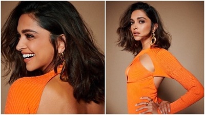 With her short hair left untamed and soft-glam makeup, Deepika Padukone gave a sensuous pose for the camera in her orange cutout dress. (Instagram/@deepikapdukone) With her short hair left untamed and soft-glam makeup, Deepika Padukone gave a sensuous pose for the camera in her orange cutout dress. (Instagram/@deepikapdukone)