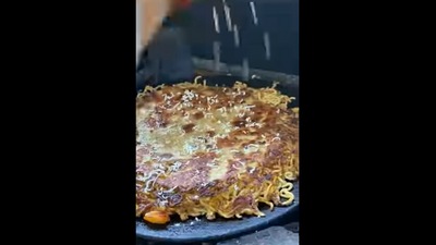 The eatery in Indore prepares the Maggi paratha by grating some cheese onto it as a finishing touch.&nbsp;