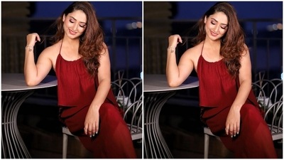 Disha posted the photos on her Instagram page with the caption, "Glossy af." She posed in an outdoor location while sitting on a chair to get the images clicked. The wine-red ensemble made with ribbed textured fabric features spaghetti straps, a wide U neckline with gathered details, a flowy front lining, maxi length and a figure-skimming silhouette. (Instagram/@dishaparmar) Disha posted the photos on her Instagram page with the caption, "Glossy af." She posed in an outdoor location while sitting on a chair to get the images clicked. The wine-red ensemble made with ribbed textured fabric features spaghetti straps, a wide U neckline with gathered details, a flowy front lining, maxi length and a figure-skimming silhouette. (Instagram/@dishaparmar)