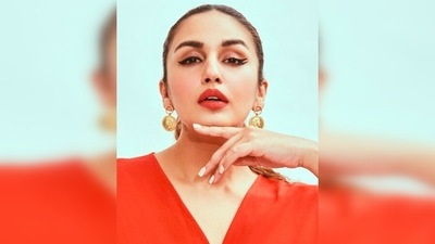 Huma Qureshi keeps it trendy yet comfy in this orange ruffle dress which she teamed with a pair of blue stilettoes. (Instagram/@iamhumaq) Huma Qureshi keeps it trendy yet comfy in this orange ruffle dress which she teamed with a pair of blue stilettoes. (Instagram/@iamhumaq)