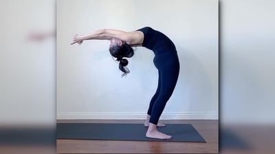 2. Hasta Uttanasana or Raised Arms Pose - From standing position, lift your arms up over your head and stretch. Inhale as you gently bend back using your head, neck and upper back. Keep your arms beside your ears as you lean back with your upper body. (Instagram/@nikkiwellsyoga) 2. Hasta Uttanasana or Raised Arms Pose - From standing position, lift your arms up over your head and stretch. Inhale as you gently bend back using your head, neck and upper back. Keep your arms beside your ears as you lean back with your upper body. (Instagram/@nikkiwellsyoga)