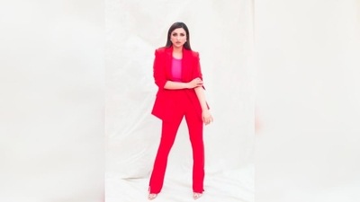 Parineeti Chopra stunned in a fuchsia round neck top which she teamed with a hot pink blazer and trousers with slits around the ankle. (Instagram/@parineetichopra) Parineeti Chopra stunned in a fuchsia round neck top which she teamed with a hot pink blazer and trousers with slits around the ankle. (Instagram/@parineetichopra)