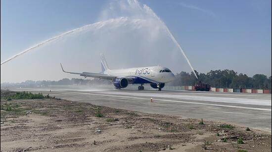 Indigo flight 6E-137 receives a water cannon salute by Indian Air Force for being the first flight to traverse through the newly constructed portion of the extended runway in Jammu. (HT Photo)