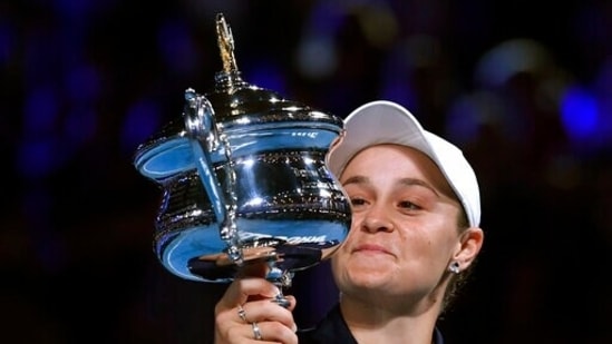 Ash Barty of Australia holds the Daphne Akhurst Memorial Cup aloft after defeating Danielle Collins of the U.S., in the women's singles final at the Australian Open tennis championships.(AP)