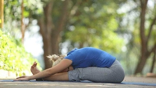 4. Paschimottanasana or Seated Forward Bend Pose - Sit with legs stretched out. Inhale and lift your arms up. Keep your back straight. Exhale and fold forward to place your upper body on your lower body. (Twitter/aol_chennai)