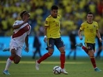Colombia's Luis Diaz in action with Peru's Andre Carrillo