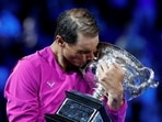 Spain's Rafael Nadal celebrates winning the final with trophy.