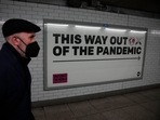 “This year we could end the acute phase of the #COVID19 pandemic if we vaccinate 70% of the population of every country,” WHO chief Tedros Adhanom Ghebreyesus said. In picture - A health campaign poster in an underpass leading to Westminster underground train station in London.