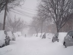 A resident walks down a street during a blizzard in Boston, Massachusetts, US, on Saturday, January, 29, 2022. (Photographer: Allison Dinner/Bloomberg) A resident walks down a street during a blizzard in Boston, Massachusetts, US, on Saturday, January, 29, 2022. (Photographer: Allison Dinner/Bloomberg)
