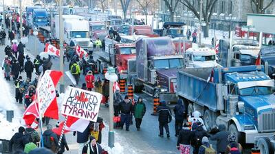 Trucks sit parked on Wellington Street near the Parliament Buildings as truckers and their supporters take part in a convoy to protest coronavirus disease vaccine mandates for cross-border truck drivers in Ottawa, Ontario, Canada. (REUTERS) Trucks sit parked on Wellington Street near the Parliament Buildings as truckers and their supporters take part in a convoy to protest coronavirus disease vaccine mandates for cross-border truck drivers in Ottawa, Ontario, Canada. (REUTERS)