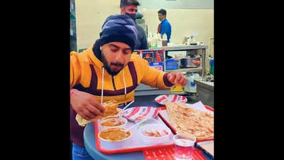 A screengrab from the viral food challenge video where a man completes a thali and wins Rs. 5,100. (facebook/@LiveLimitlessVlogs) A screengrab from the viral food challenge video where a man completes a thali and wins Rs. 5,100. (facebook/@LiveLimitlessVlogs)