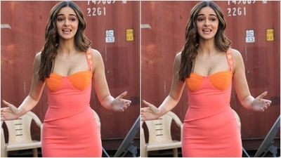 Ananya's orange and pink dress features a trendy mini hem length, a deep sweetheart neckline, a fitted silhouette hugging her svelte frame and broad straps with gold embellished buttons. (HT Photo/Varinder Chawla) Ananya's orange and pink dress features a trendy mini hem length, a deep sweetheart neckline, a fitted silhouette hugging her svelte frame and broad straps with gold embellished buttons. (HT Photo/Varinder Chawla)