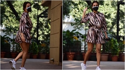 Malaika's day out outfit features blue, red and olive green stripes done all over. The romper also had a raised collar, button-up detail on the torso, a fabric belt tie to cinch the dress on the waist, gathered sleeves, folded hem, and a breezy silhouette. (HT Photo/Varinder Chawla) Malaika's day out outfit features blue, red and olive green stripes done all over. The romper also had a raised collar, button-up detail on the torso, a fabric belt tie to cinch the dress on the waist, gathered sleeves, folded hem, and a breezy silhouette. (HT Photo/Varinder Chawla)
