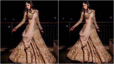 The new bride had opted for a heavy gold lehenga for the occasion and looked absolutely resplendent. Mouni posted pictures of herself twirling and smiling for the cameras as they captured her enjoying the big day. (Instagram/@imouniroy) The new bride had opted for a heavy gold lehenga for the occasion and looked absolutely resplendent. Mouni posted pictures of herself twirling and smiling for the cameras as they captured her enjoying the big day. (Instagram/@imouniroy)