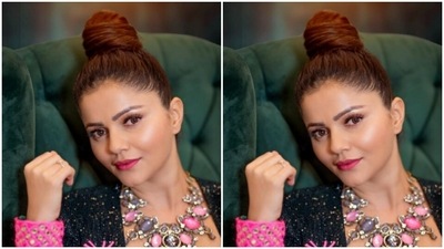 Rubina paired a black shimmery bra with a pair of trousers with wide legs. She teamed it with a black blazer embroidered in pink zari, moti and mirror details. (Instagram/@rubinadilaik)