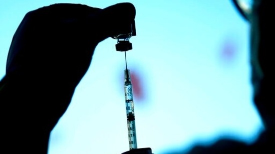 A dose of a Pfizer Covid-19 vaccine is prepared at children's hospital.(AP)