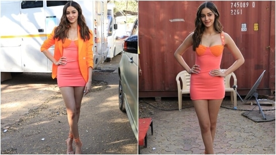 Ananya wore the mini length ensemble with an oversized orange blazer featuring notch lapel collars, pulled-back full sleeves and raised shoulders. The Gehraiyaan actor rounded off her outfit by wearing peep-toe strappy pumps featuring orange and metallic straps.(HT Photo/Varinder Chawla)